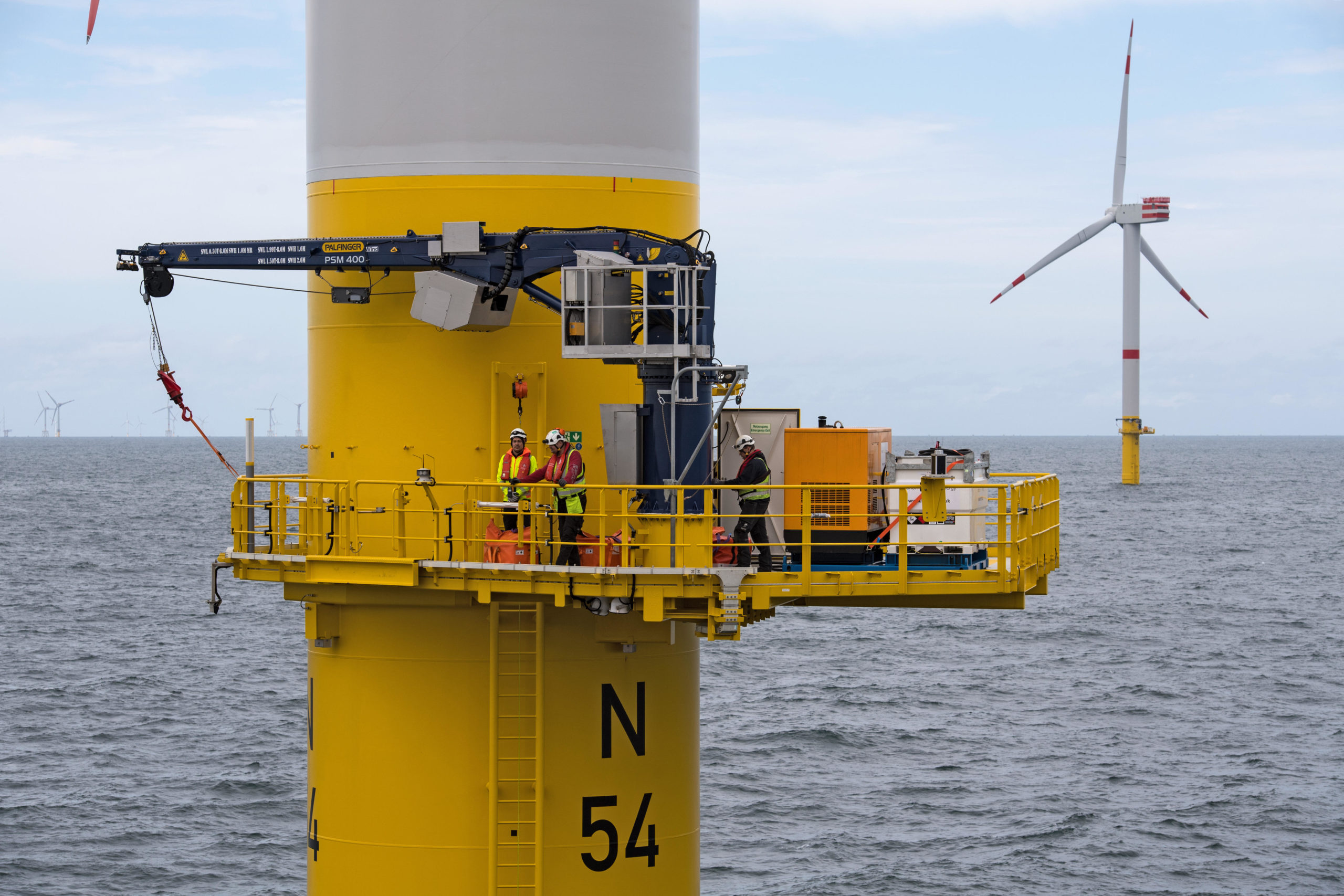 workers on offshore wind turbine