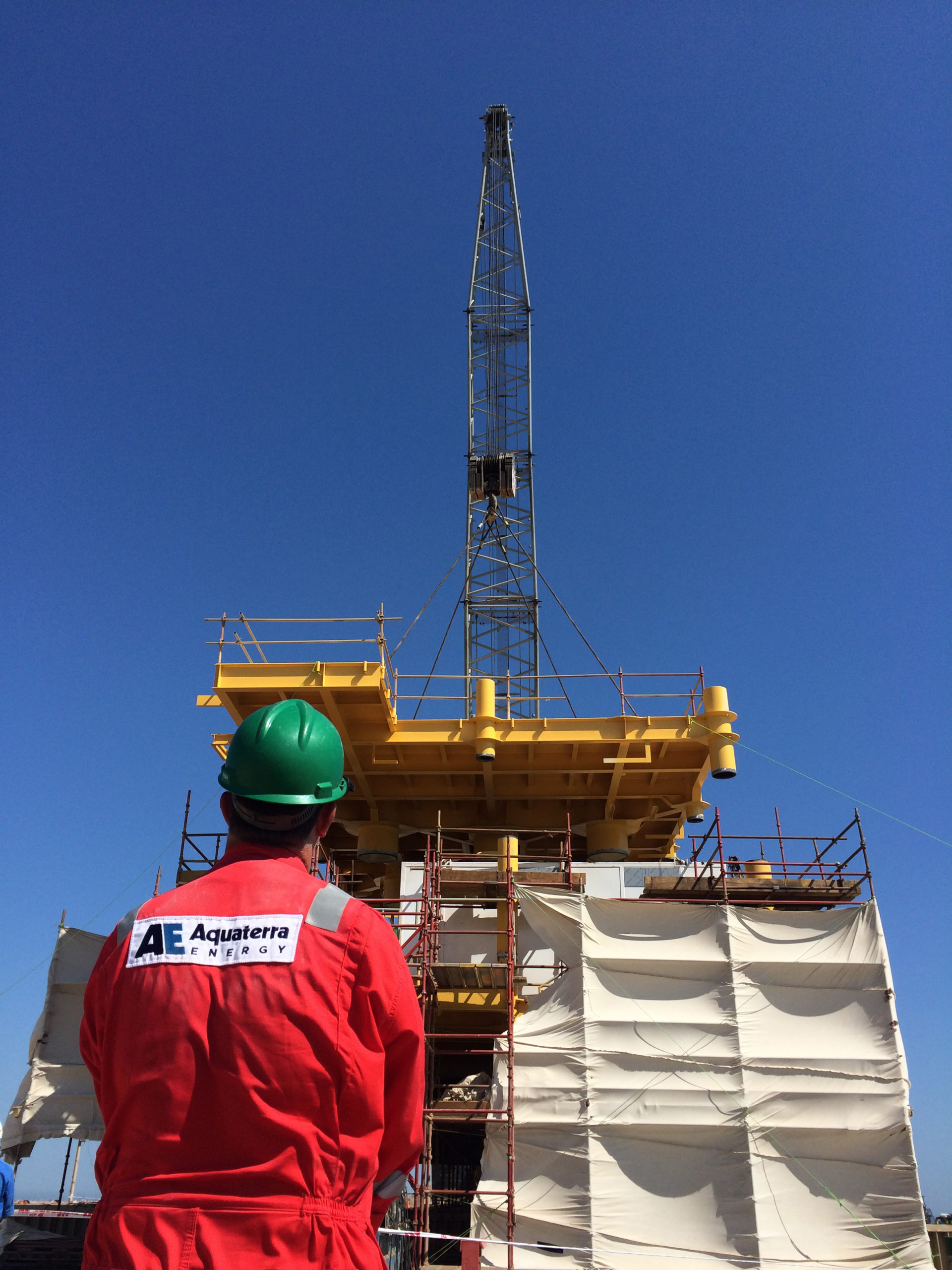 AE worker standing in front of equipment