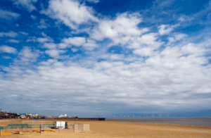 Great Yarmouth beach with wind farm in the background at sea